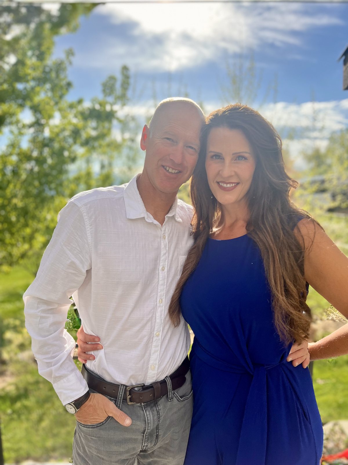 Candace and her husband outdoors in warm natural light