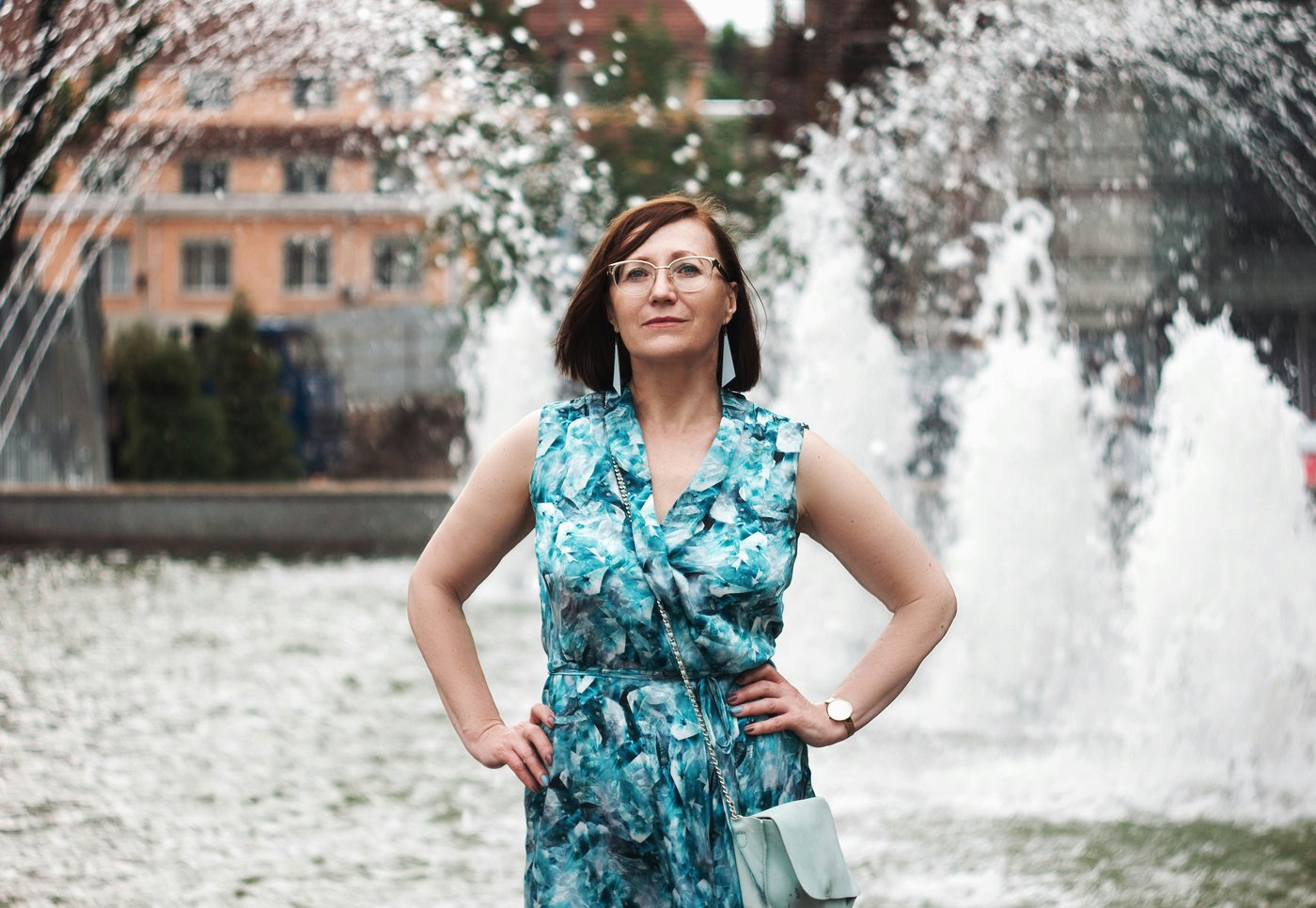 A woman standing tall, chin up, self-assured in the open air
