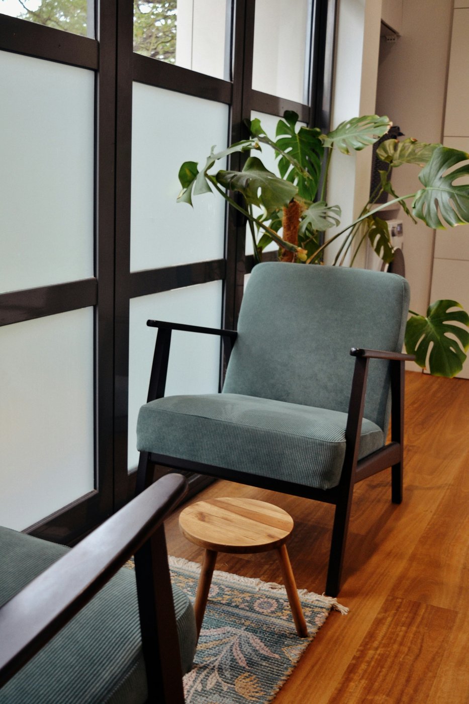 Two chairs by a window in soft light, a quiet room set for an honest conversation
